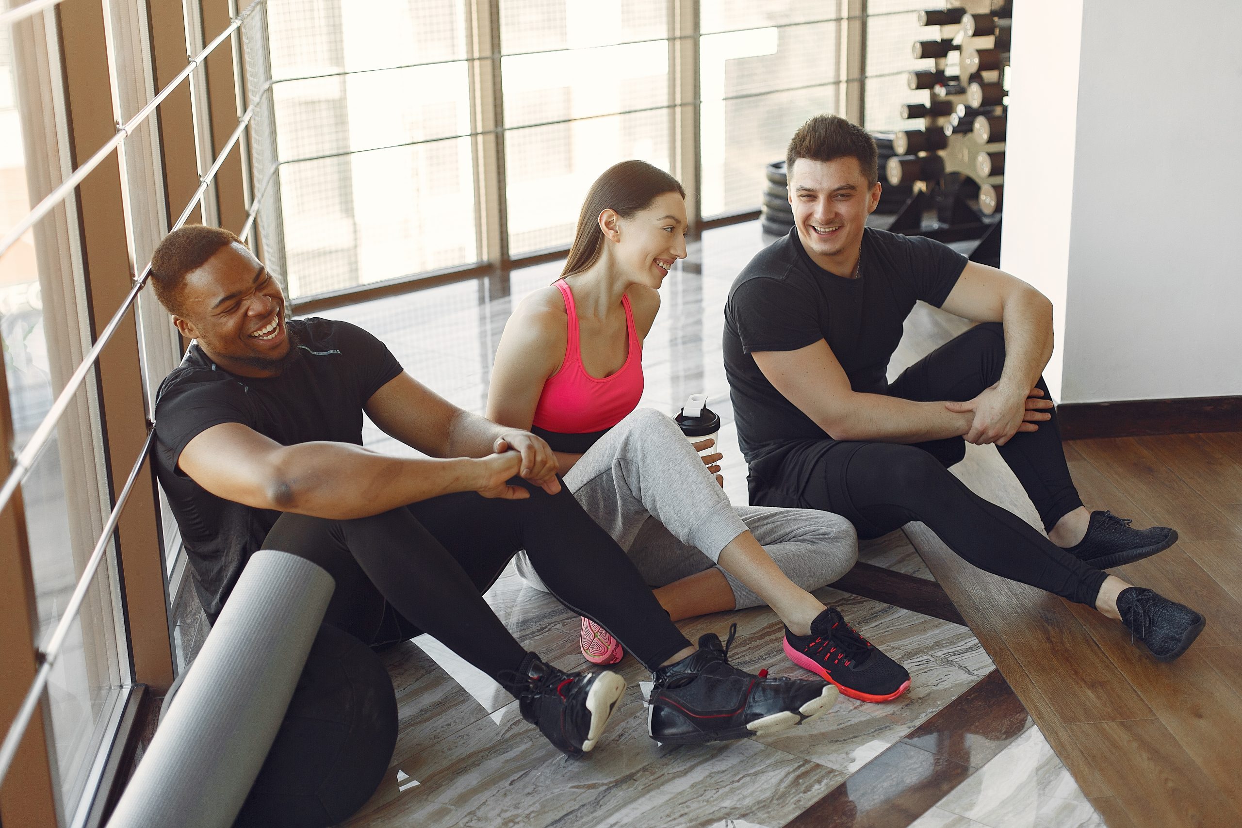 Young sports people training in a morning gym people training at work