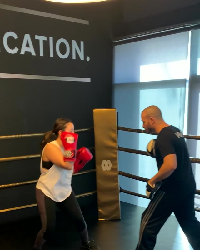 Mike coaching a client on the pads